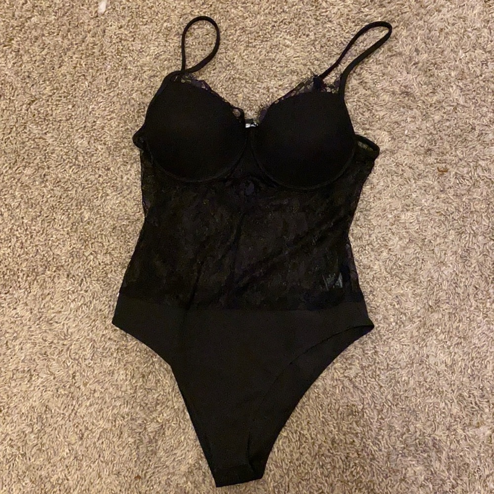 Black laced cami bodysuit. Never worn